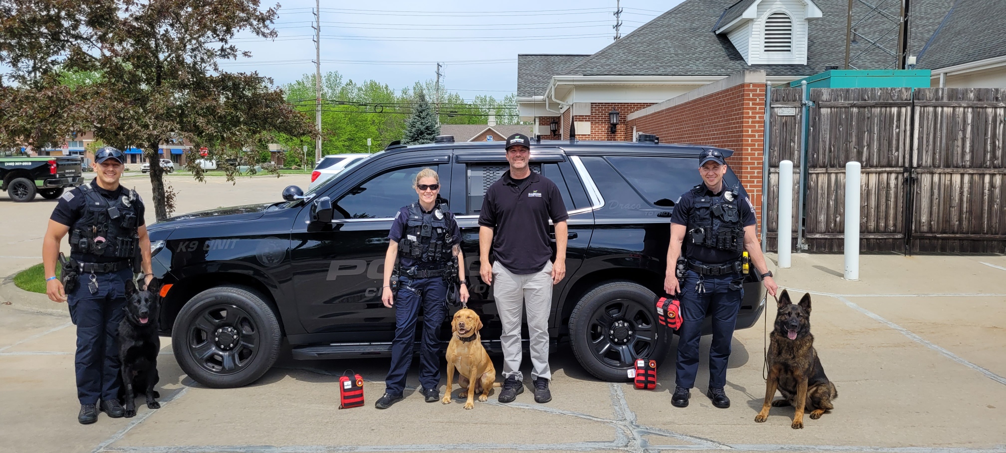 Justin Henry of DogWatch Hidden Fences of Cleveland donates K9 Medic Kits to Avon Ohio Police K9 Units.